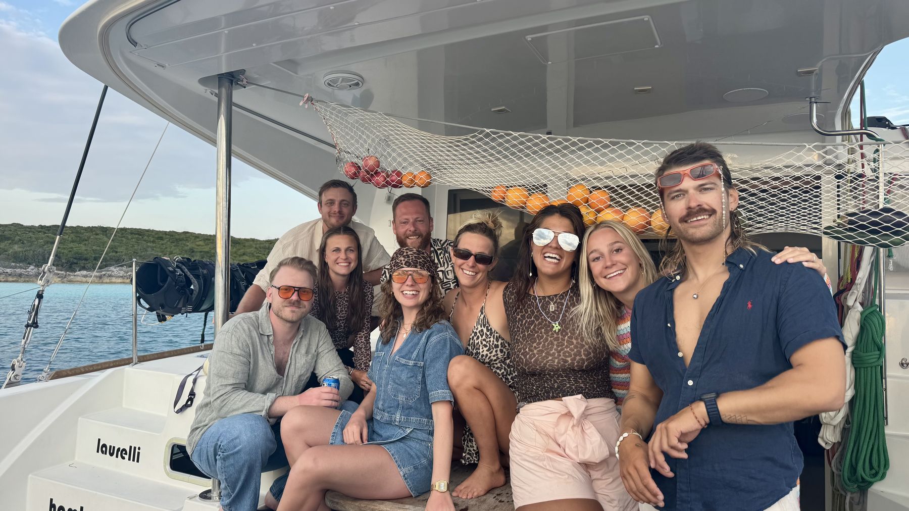 Crew group photo on the transom under the fruit net