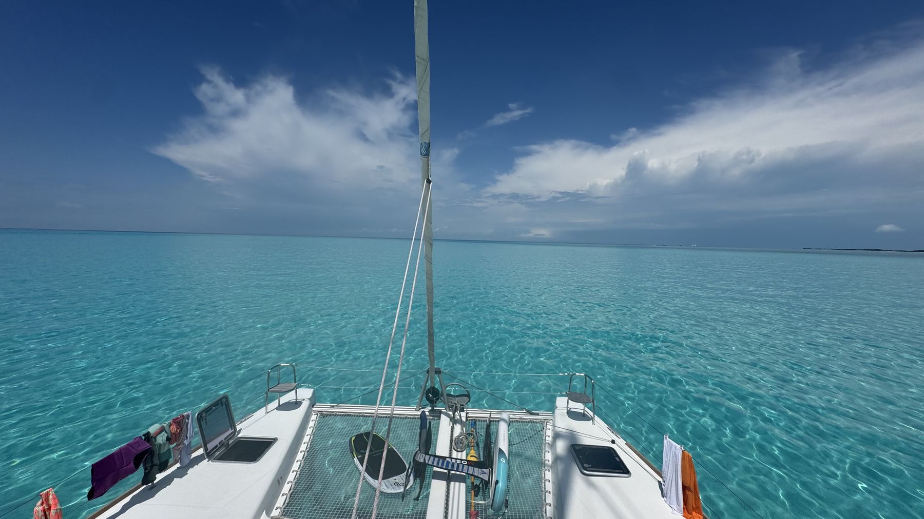 View forward over the trampoline into clear turquoise water