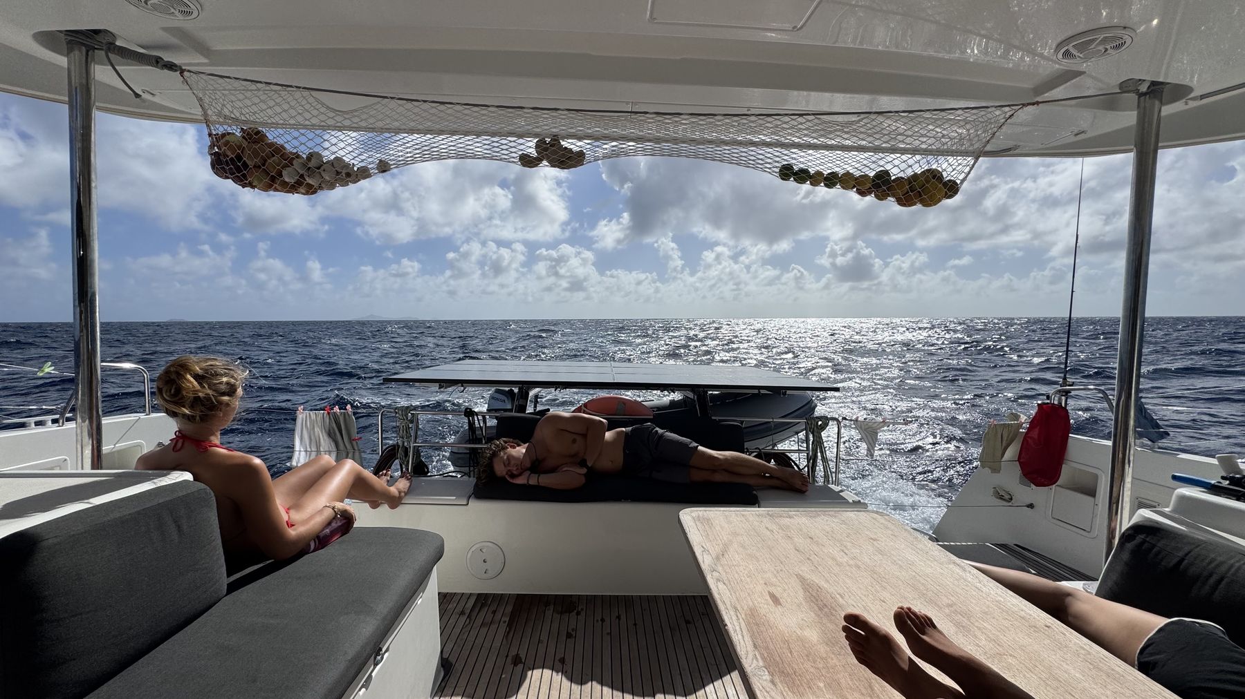 Crew lounging in the cockpit while underway