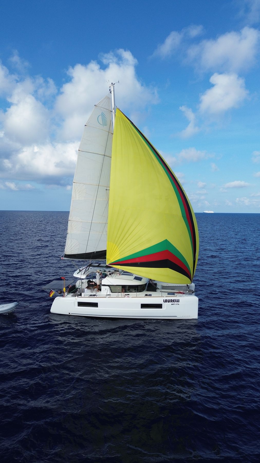 Laurelli sailing with a colourful spinnaker up