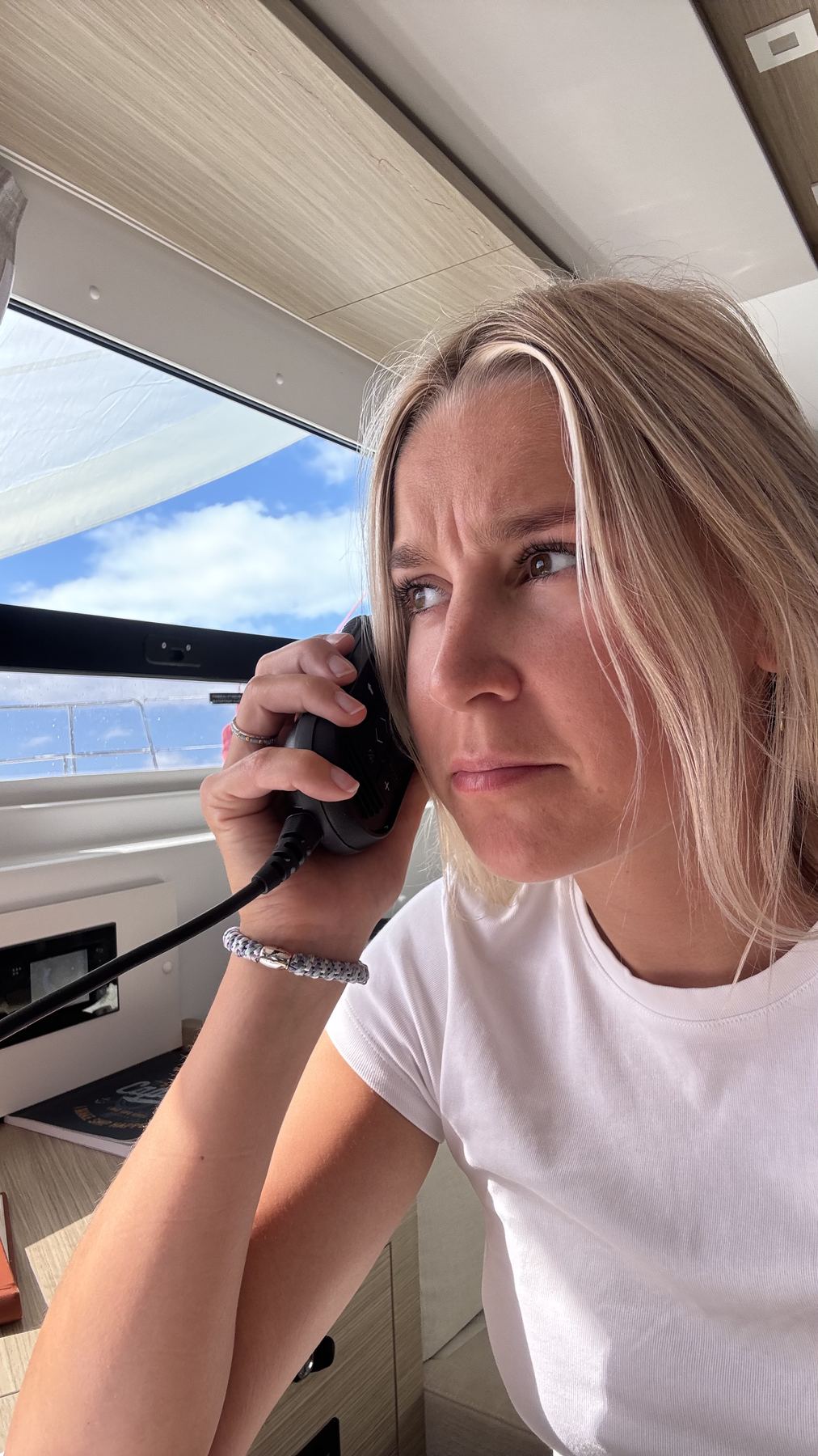 Ella on the VHF radio in the cockpit