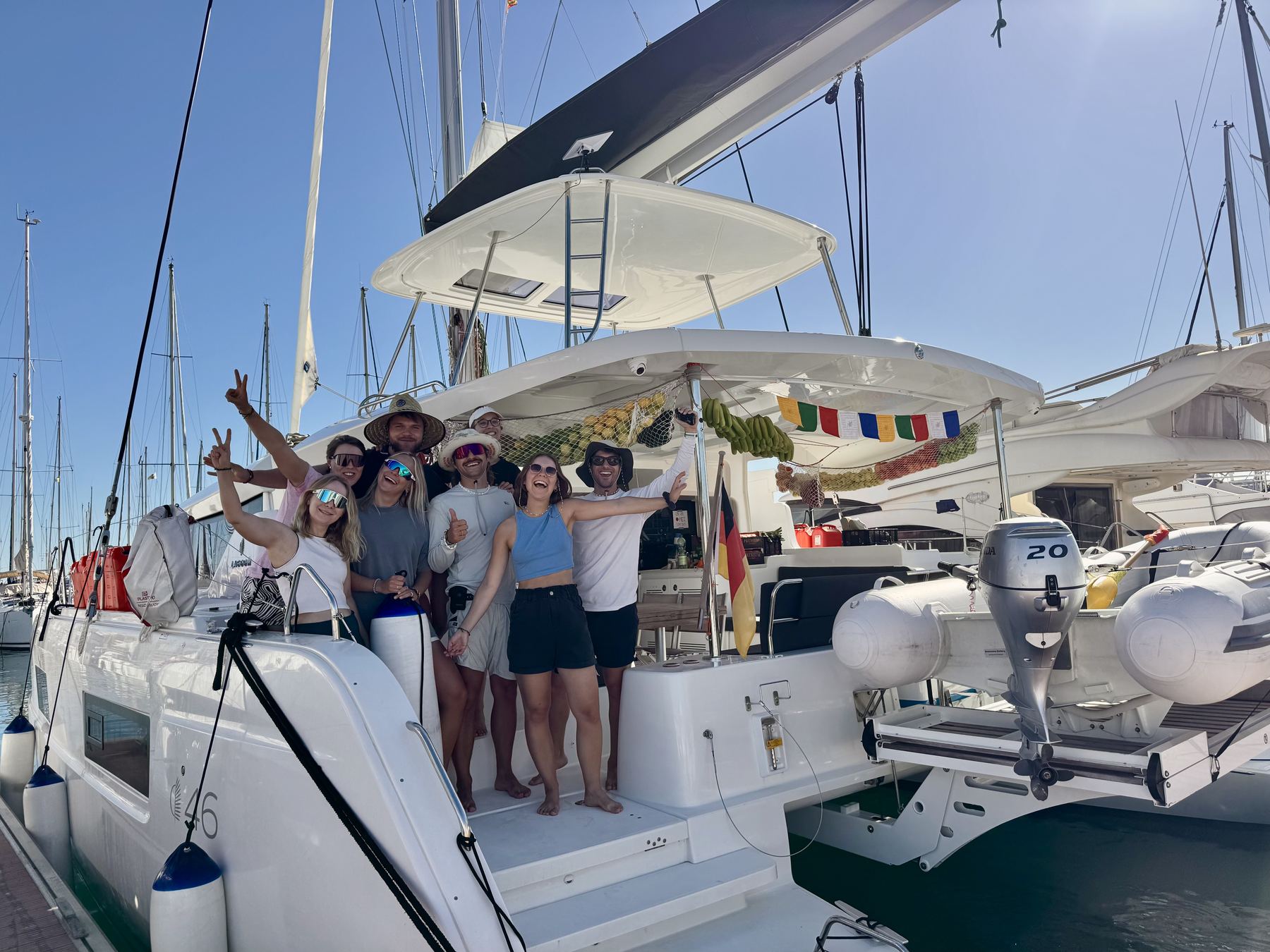 Crew celebrating on a catamaran, the trip where Felix met Ella